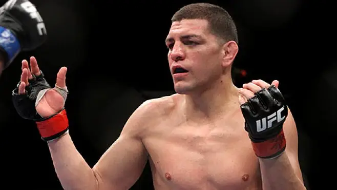 Nick Diaz with hands raised